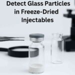 Visual inspection of freeze-dried injectable vials to detect glass particles using a magnifying glass in a pharmaceutical lab.”